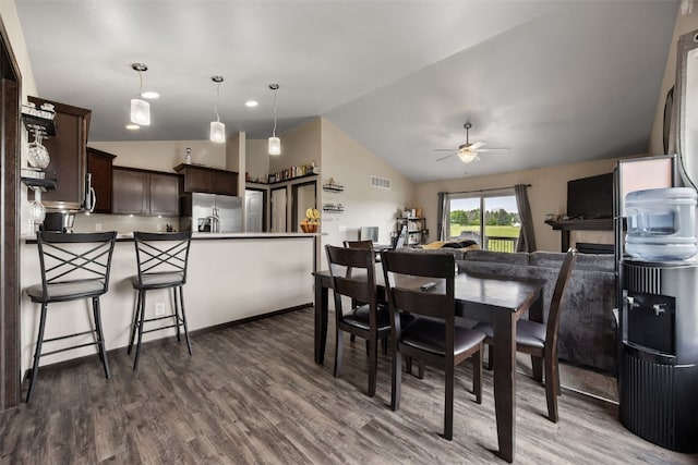 1330 Redbud Ave, Tiffin, IA 52340 - dining room featuring vaulted ceiling, ceiling fan, and dark wood-style floors