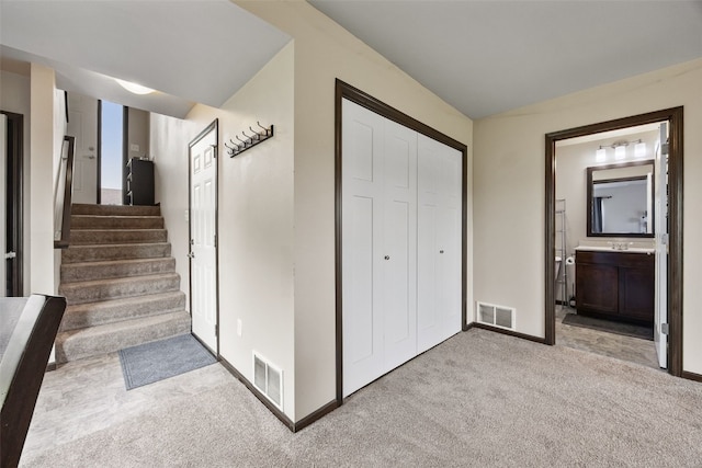 1330 Redbud Ave, Tiffin, IA 52340 - carpeted foyer entrance with baseboards and stairway