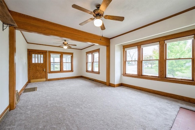 662 19th Ave SW, Cedar Rapids, IA 52404 - empty room featuring baseboards, light carpet, a ceiling fan, crown molding, and beamed ceiling