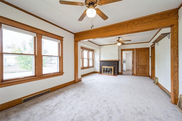 662 19th Ave SW, Cedar Rapids, IA 52404 - unfurnished living room featuring light colored carpet, baseboards, a ceiling fan, and crown molding