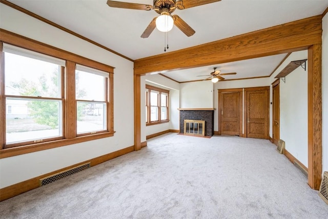 662 19th Ave SW, Cedar Rapids, IA 52404 - unfurnished living room with light carpet, baseboards, a ceiling fan, a brick fireplace, and crown molding