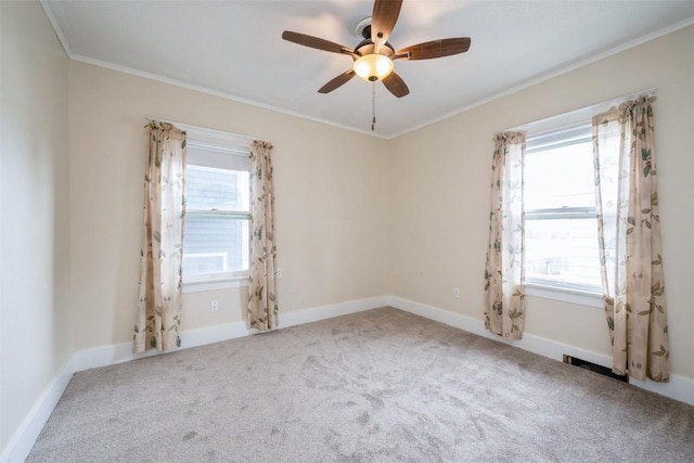 662 19th Ave SW, Cedar Rapids, IA 52404 - unfurnished room with ornamental molding, a ceiling fan, carpet, and baseboards