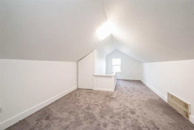 662 19th Ave SW, Cedar Rapids, IA 52404 - additional living space with lofted ceiling, carpet floors, and baseboards