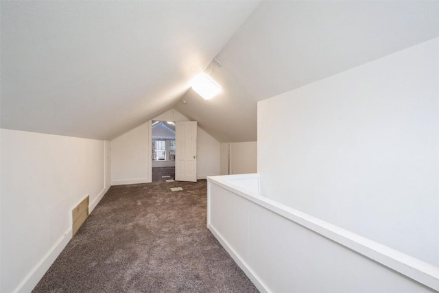 662 19th Ave SW, Cedar Rapids, IA 52404 - additional living space featuring carpet, lofted ceiling, and baseboards