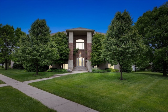 364 Camden Rd, Iowa City, IA 52245 - view of front of house with a front yard and brick siding