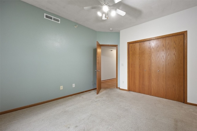 364 Camden Rd, Iowa City, IA 52245 - unfurnished bedroom with light carpet, a closet, baseboards, and ceiling fan