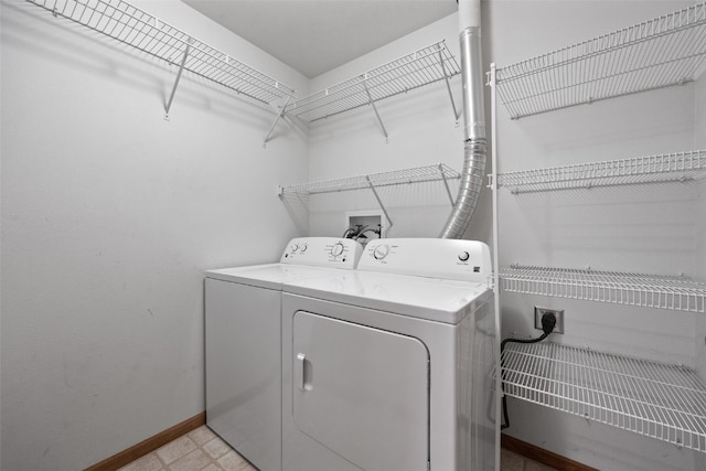 364 Camden Rd, Iowa City, IA 52245 - laundry room with separate washer and dryer and baseboards