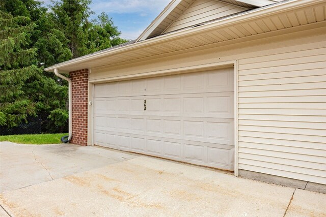 364 Camden Rd, Iowa City, IA 52245 - garage featuring driveway