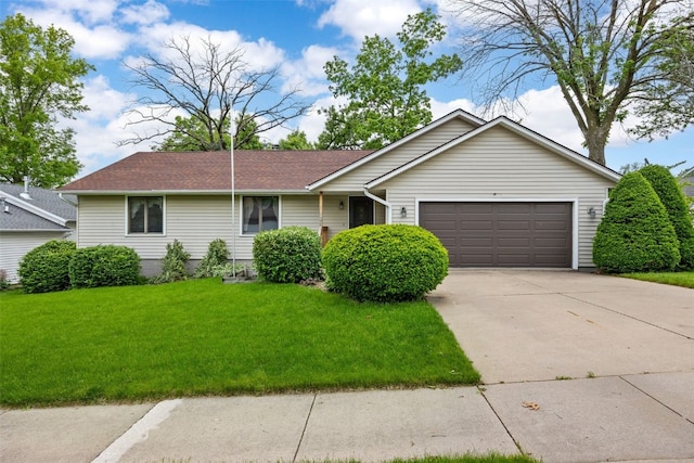 1042 Arthur Dr NW, Cedar Rapids, IA 52405 - single story home featuring a garage, concrete driveway, a front lawn, and roof with shingles