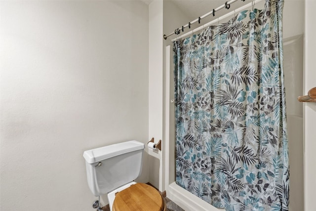1042 Arthur Dr NW, Cedar Rapids, IA 52405 - bathroom with a shower stall and toilet
