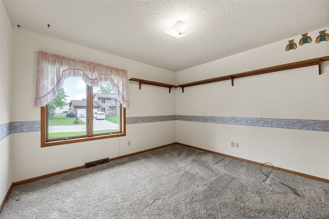 1042 Arthur Dr NW, Cedar Rapids, IA 52405 - unfurnished room featuring carpet and a textured ceiling