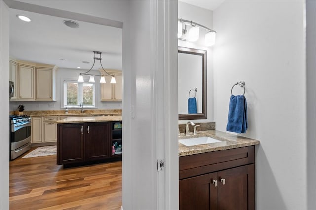 4000 Majestic Ct NE, Cedar Rapids, IA 52411 - bathroom featuring vanity, wood finished floors, and recessed lighting