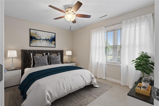 4000 Majestic Ct NE, Cedar Rapids, IA 52411 - bedroom featuring light carpet, baseboards, and a ceiling fan