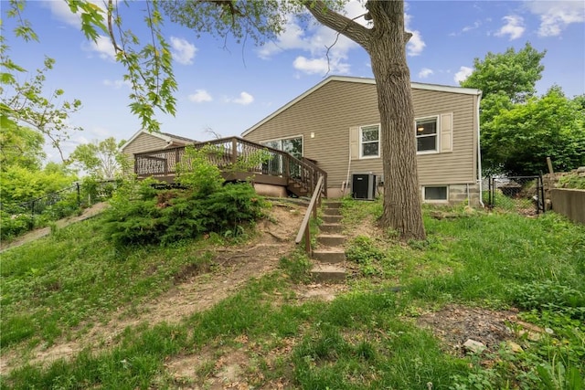 654 34th St SE, Cedar Rapids, IA 52403 - back of house featuring a wooden deck, stairway, and central AC unit
