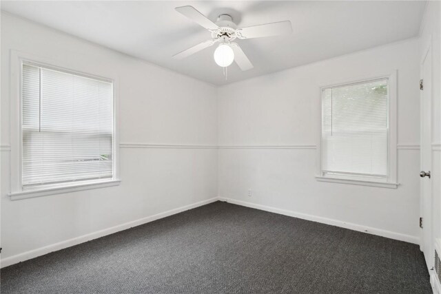654 34th St SE, Cedar Rapids, IA 52403 - empty room featuring carpet floors, baseboards, and ceiling fan