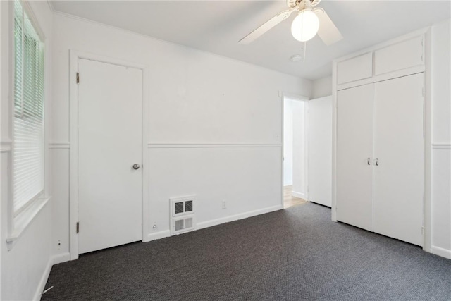 654 34th St SE, Cedar Rapids, IA 52403 - unfurnished bedroom with baseboards, carpet, ceiling fan, and a closet