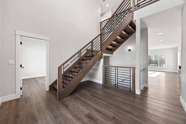 1504 Legend Dr, Tiffin, IA 52340 - staircase with wood finished floors, baseboards, and recessed lighting