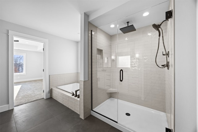 1504 Legend Dr, Tiffin, IA 52340 - bathroom featuring a stall shower, a bath, tile patterned floors, recessed lighting, and baseboards