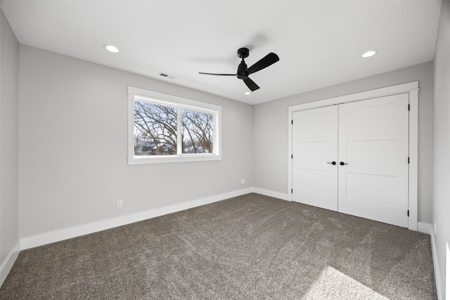 1504 Legend Dr, Tiffin, IA 52340 - unfurnished bedroom featuring dark colored carpet, a closet, recessed lighting, baseboards, and a ceiling fan