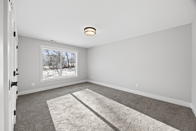 1504 Legend Dr, Tiffin, IA 52340 - spare room featuring carpet and baseboards