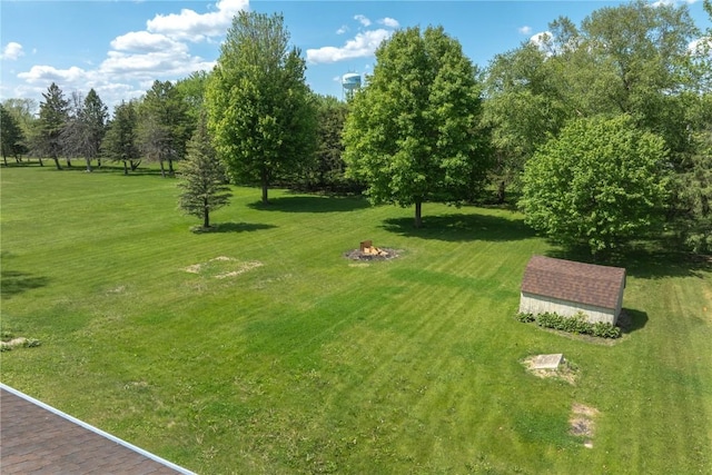 409 Oak St, Rowley, IA 52329 - view of community with a yard and an outdoor fire pit