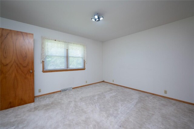 409 Oak St, Rowley, IA 52329 - unfurnished room with carpet flooring and baseboards