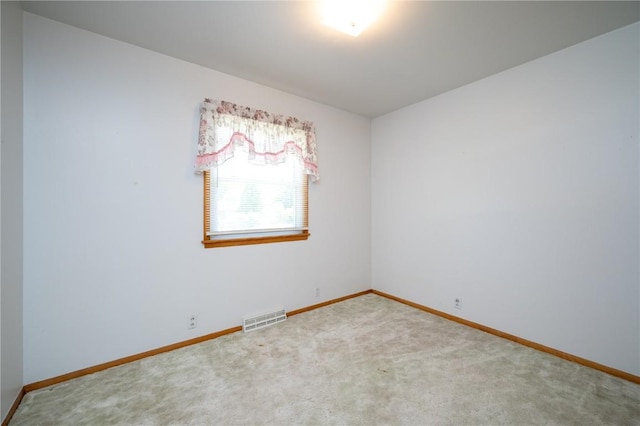 409 Oak St, Rowley, IA 52329 - carpeted spare room featuring baseboards
