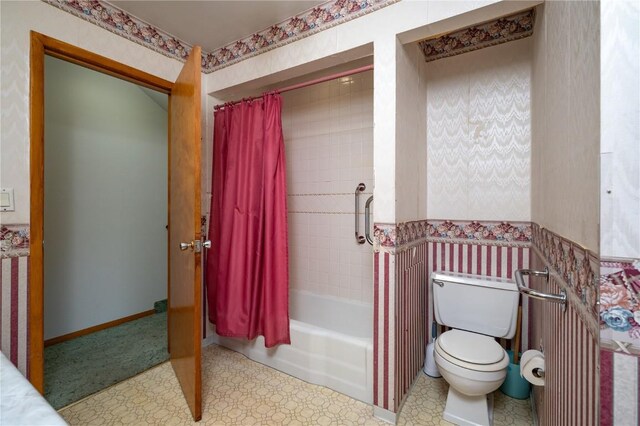 409 Oak St, Rowley, IA 52329 - bathroom featuring toilet, tile patterned floors, shower / bathtub combination with curtain, and wallpapered walls