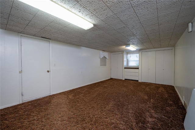 409 Oak St, Rowley, IA 52329 - below grade area featuring carpet flooring