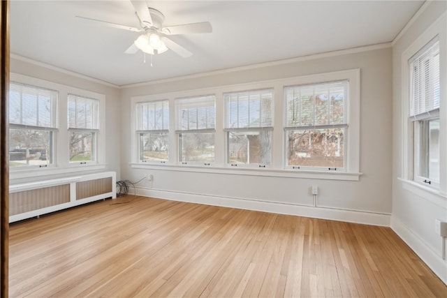 2325 Grande Ave SE, Cedar Rapids, IA 52403 - unfurnished sunroom with radiator heating unit and healthy amount of natural light