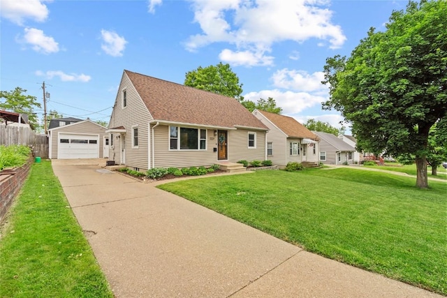 2224 Mallory St SW, Cedar Rapids, IA 52404 - cape cod-style house with a garage, an outdoor structure, and roof with shingles