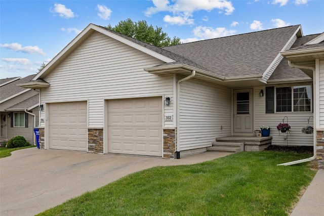 302 Duchess Dr, Solon, IA 52333 - view of front of house featuring an attached garage, driveway, a shingled roof, a front lawn, and stone siding