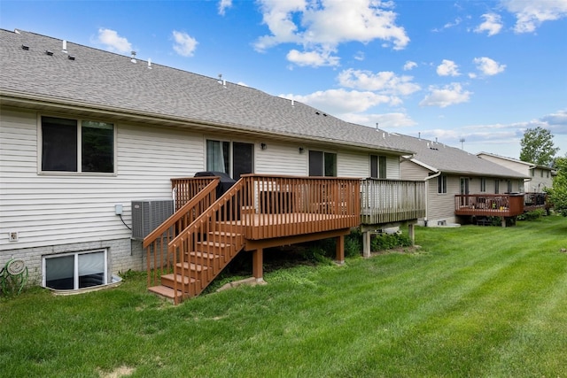 302 Duchess Dr, Solon, IA 52333 - back of house with a wooden deck, a lawn, and roof with shingles