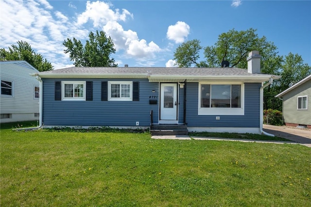 4721 Midway Dr NW, Cedar Rapids, IA 52405 - ranch-style house with a front yard and a chimney