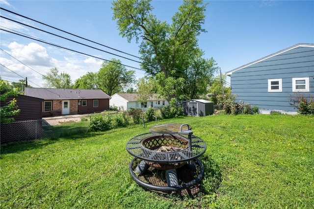 4721 Midway Dr NW, Cedar Rapids, IA 52405 - view of yard with a fire pit and a shed