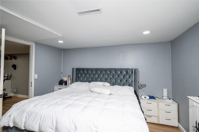 4721 Midway Dr NW, Cedar Rapids, IA 52405 - bedroom with light wood finished floors and recessed lighting