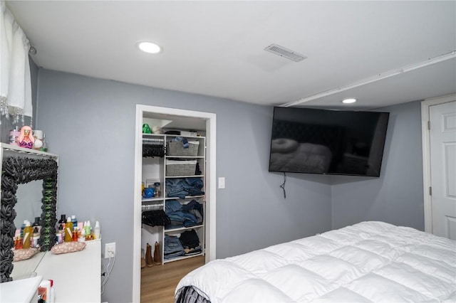 4721 Midway Dr NW, Cedar Rapids, IA 52405 - bedroom with wood finished floors, recessed lighting, and a closet
