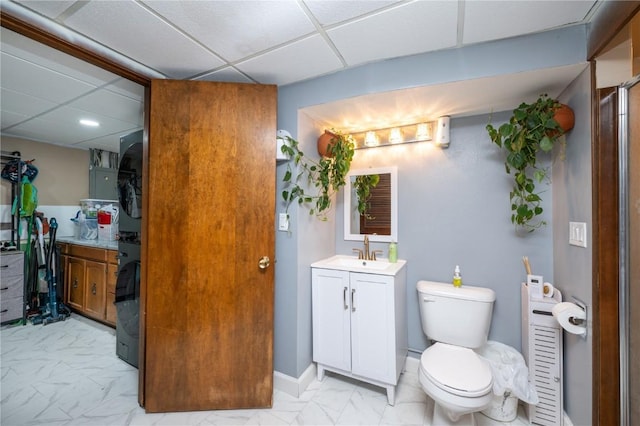 4721 Midway Dr NW, Cedar Rapids, IA 52405 - bathroom featuring a paneled ceiling, vanity, marble finish flooring, and recessed lighting