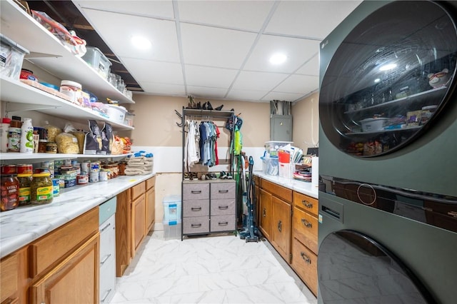 4721 Midway Dr NW, Cedar Rapids, IA 52405 - laundry area featuring estacked washer and dryer, light marble finish floors, and electric panel