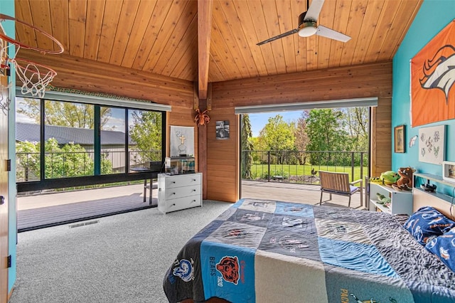 3715 170th St NE, Solon, IA 52333 - carpeted bedroom featuring wooden walls, multiple windows, access to outside, wooden ceiling, and a ceiling fan