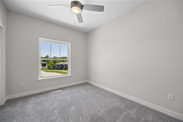 706 Silver Ln, Iowa City, IA 52245 - carpeted spare room with baseboards and a ceiling fan