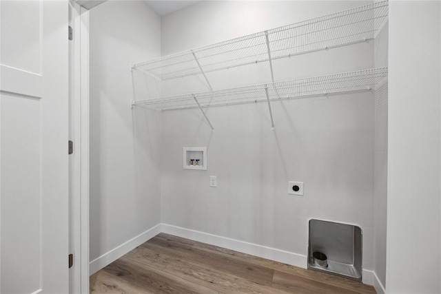 706 Silver Ln, Iowa City, IA 52245 - washroom featuring hookup for a washing machine, wood finished floors, electric dryer hookup, and baseboards
