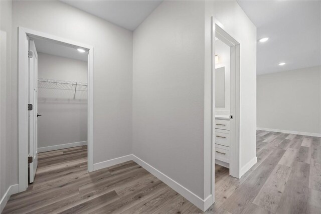 706 Silver Ln, Iowa City, IA 52245 - hallway featuring light wood-style flooring, baseboards, and recessed lighting