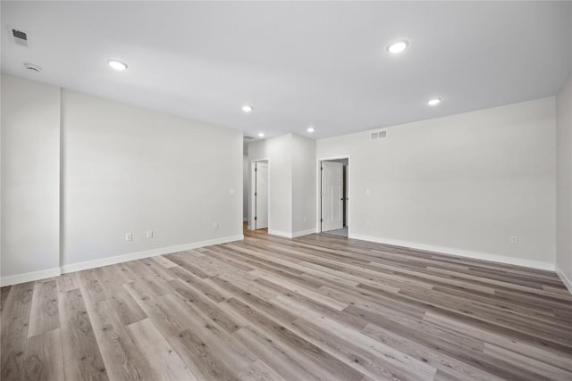 706 Silver Ln, Iowa City, IA 52245 - unfurnished room featuring light wood-type flooring, recessed lighting, and baseboards