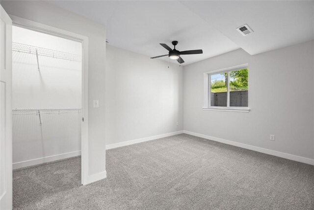 706 Silver Ln, Iowa City, IA 52245 - unfurnished bedroom with carpet flooring, baseboards, ceiling fan, and a closet