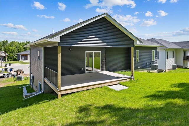 706 Silver Ln, Iowa City, IA 52245 - back of property with a deck and a lawn