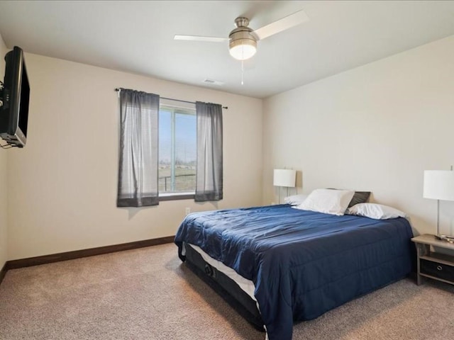 902 Creekside Dr, Tiffin, IA 52340 - carpeted bedroom featuring baseboards and a ceiling fan