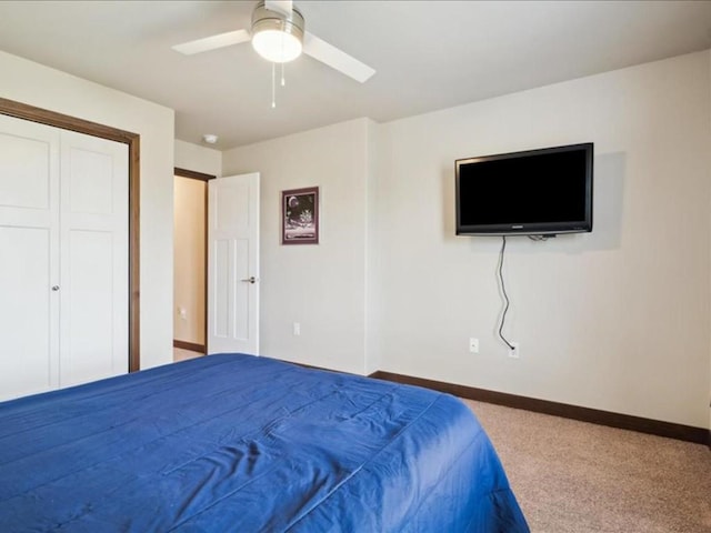 902 Creekside Dr, Tiffin, IA 52340 - carpeted bedroom featuring baseboards, a ceiling fan, and a closet