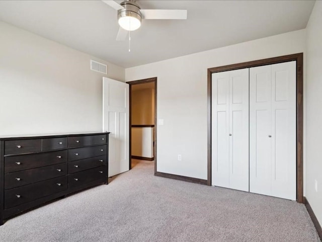 902 Creekside Dr, Tiffin, IA 52340 - unfurnished bedroom featuring light carpet, baseboards, a closet, and a ceiling fan