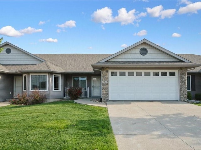 3314 35th Ave, Marion, IA 52302 - ranch-style house featuring an attached garage, concrete driveway, a front yard, stone siding, and roof with shingles